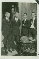 Image of four young men waiting for the train. Howorth Photograph Collection.Circa 1910-1925.