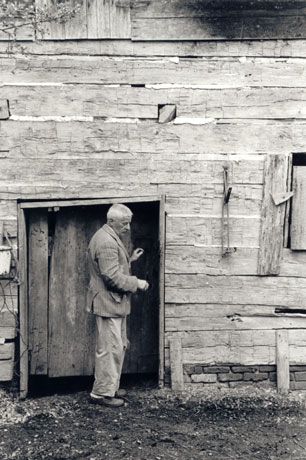 William Faulkner in front of his barn