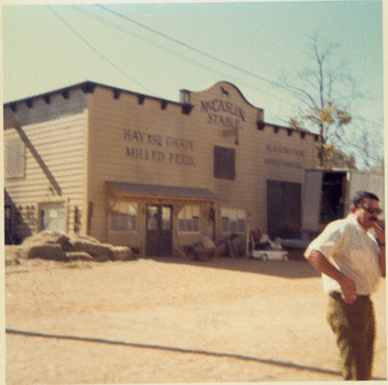  Color Photograph. 3  inches x 3  inches. Image of the McCaslin Stable on the movie set of The Reivers. In reality it was a covered service station. October 1968.